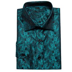 Introducing the Midnight Black and Lake Blue Paisley Silk Dress Shirt, a luxurious addition to your wardrobe. Crafted from the finest silk, this dress shirt offers an exceptionally smooth and comfortable feel. The deep midnight black fabric is beautifully complemented by an intricate lake blue paisley pattern, creating a striking and sophisticated design that exudes elegance. Ideal for formal events and upscale gatherings, this shirt effortlessly combines classic charm with contemporary flair. T Elegant Blue Semi-formal Dress Shirt, Elegant Long Sleeve Shirt With Paisley Print, Elegant Blue Fitted Dress Shirt, Elegant Fitted Blue Dress Shirt, Formal Blue Silk Shirt, Fitted Silk Blue Shirt, Elegant Slim Fit Shirt For Night Out, Formal Blue Satin Shirt, Elegant Blue Satin Shirt