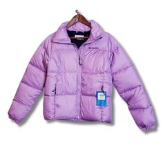 Columbia Perfect Puffer Jacket Womens Xs Purple Water-Resistant Full Zip Quilted New With Tags ~ Excellent Condition No Issues Stay Cozy And Stylish In The Women's Columbia Puffer Jacket Crafted With Water-Resistant Fabric, This Jacket Features: Thermarator Insulation To Keep You Warm In Colder Weather. For Added Comfort And Utility, The Jacket Comes Equipped With A Chin Guard, Zippered Hand Pockets, And Elastic Cuffs. Ideal For Those Who Love Outdoor Adventures And Seeking To Stay Warm During Cold Seasons. Chest: 19.5 In Length: 23.5 In Weight: 1lb 9.7oz Ship Same Day And Next! Tags: Puffer Winter Barbie Core Academia Travel Thermarator Insulation Cozy Comfortable Bin X Insulated Long Sleeve Outerwear For Hiking, Puffer Jacket With Padded Collar For Outdoor Activities, Long Sleeve Down Outerwear For Winter Sports, Insulated Long Sleeve Puffer Jacket For Winter Sports, Fitted Solid Puffer Jacket For Outdoor, Down Outerwear For Hiking, Spring Outdoor Down Outerwear, Insulated Long Sleeve Puffer Jacket For Hiking, Winter Fitted Puffer Jacket For Outdoor Activities