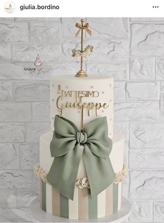 a cake with a cross and bow on top