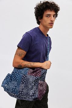 Bandana patchwork shoulder bag with utility style pockets. Bag features a zippered main storage compartment and adjustable shoulder strap. Features Bandana patch shoulder bag Patchwork utility bag Zippered main compartment Outer storage pockets Adjustable strap Content + Care 100% Cotton Spot clean Imported | Bandana Patch Shoulder Bag in Assorted, Men's at Urban Outfitters Blue Shoulder Bag With Functional Pockets, Blue Shoulder Bag With Side Pockets For Travel, Blue Rectangular Bag With Multiple Pockets, Blue Travel Shoulder Bag With Side Pockets, Casual Patchwork Shoulder Bag, Casual Tote Shoulder Bag With Functional Pockets, Blue Bags With Side Pockets For Daily Use, Casual Patchwork Tote Shoulder Bag, Blue Shoulder Bag With Multiple Pockets For Everyday Use