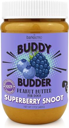 a jar of peanut butter with blueberries in it on a white surface and the label says, buddy budder peanut butter