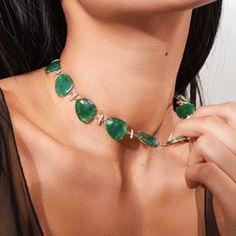 Traditional precious gemstones take on an understated wearable faceting with the Ecksand Mosaic collection. This reversible aventurine and gold necklace pays tribute to Mother Nature with its showstopping, bold look. Worn on its gold or gemstone side, this necklace offers complete versatility to create an audacious statement, accented by a brilliant diamond pavé. Aventurines: each 18x16 mm approx. Accent diamonds: 1.65+ ctw, VS2+/F+ Necklace length: 16 / 18 in. Closure: Lobster clasp Luxury Fusion Style Necklaces With Stones, Luxury Oval Fusion Necklace, Emerald Statement Necklace, F Necklace, Tribute To Mother, Modern Necklace Design, Diamond Pendant Sets, Modern Necklace, Contemporary Earrings