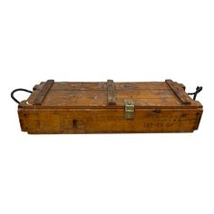 an old wooden box with metal handles