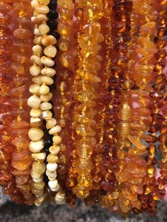 You will get one raw or polished 12.5 - 13 inch varied shape Baltic Amber Necklace. OR 5.5 to 6 Inch Bracelet. No comments or preferences will be considered. No limit on the number you can order. Rock bottom prices. NO returns allowed (unless broken when received. You must email/contact us within 12 hours of receipt with a photo of the break)!! Fits most: 8 months - 5 years Luxury Amber Beaded Necklaces With Natural Stones, Luxury Amber Carnelian Jewelry, Luxury Baltic Amber Necklace In Amber Color, Luxury Orange Agate Necklace, Cheap Amber Necklaces, Luxury Bohemian Amber Beads And Cabochons, Luxury Amber Bohemian Beads, Luxury Amber Necklaces In Fine Jewelry Style, Luxury Amber Gemstone Necklace