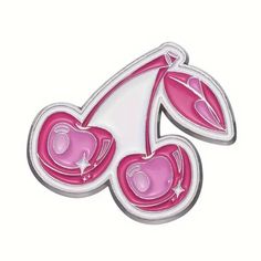 a pink and white brooch with hearts on it