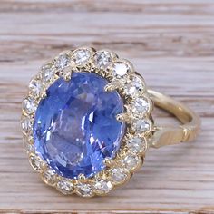 A vintage Ceylon sapphire ring of unsurpassable class. The sapphire - certified as natural, unheated and originating from Ceylon (Sri Lanka) is the ideal cornflower blue. The stone is secured in a claw setting within a surround of twenty high white and bright eight cut diamonds. The wonderfully pierced under-gallery leads to a slender 18k yellow gold shank. Accompanied by a sapphire report from Gemmological Certification Services (GCS) stating the sapphire shows no indication of heating, and is Luxury Handmade Sapphire Ring Fine Jewelry, Heirloom Brilliant Cut Luxury Sapphire Ring, Luxury Heirloom Sapphire Ring With Round Cut, Luxury Octagon Sapphire Ring With Diamonds, Luxury Cabochon Sapphire Engagement Ring, Luxury Heirloom Round Sapphire Ring, Luxury Modern Octagon Sapphire Ring, Luxury Heirloom Style Round Sapphire Ring, Handmade Luxury Sapphire Ring