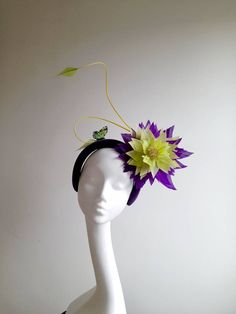 Lime green and purple feather flower mounted on a purple headband, finished with yellow twin quills and lime green butterflies. Flower measures 20cm in length (approx) Flower measures 22cm in width (approx) Purple Handmade Flowers Headband, Purple Headband With Handmade Flowers, Green Fascinator With Handmade Flowers For Party, Kentucky Derby Green Fascinator With Handmade Flowers, Green Summer Fascinator With Handmade Flowers, Green Spring Fascinator With Handmade Flowers, Green Fascinator With Handmade Flowers For Spring, Green Handmade Flowers Fascinator For Spring, Purple Summer Fascinator With Handmade Flowers