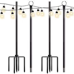 four poles with lights hanging from them and one pole has five lamps on each pole