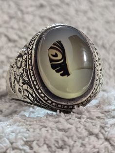 We show you a very old ring Onyx stone with a very clear picture of a fish One of the most requested stones because it is 100% natural. A mixture of colors on a stone of white Yemeni agate, one of the most beautiful stones, handmade The color of the stone is one of the very old rarities, old Iraqi hand work and pure silver For those who do not know what the pictured stones are, they are among the most valuable stones that contain many secrets. Out of every thousand natural agate stones, you will Vintage Silver Crystal Ring With Large Stone, Vintage Round Agate Jewelry, Antique Rings With Natural Stones, Vintage Rings With Natural Stones For Healing, Antique Round Rings With Natural Stones, Vintage Silver Crystal Ring With Natural Stones, Vintage Agate Jewelry With Large Stone, Antique Natural Stones Ring For Gift, Antique Rings With Natural Stones For Gift