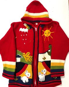 a child's red jacket with animals and birds on the front, along with a white background