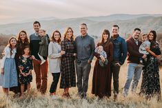 a large group of people standing in a field