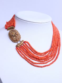 72gr Vintage Natural Coral Necklace Undyed Beads Dutch Gold Clasp 14k This is nice vintage necklace from natural coral, not dyed beads. The necklace was made in Netherlands. 8 coral strands round shape finished by a beautiful filigree large clasp made from yellow gold 14k. Classic style. Looks gorgeous! Size of beads: 3-4mm  Clasp length: 5cm /2in (with bows) Coral strand's length - 34-41cm (13,6-16,4in) +5cm clasp Clasp - yellow gold 585 (tested by acid) Weight: 72 grams Age of corals: vintage Condition: please see condition on photo! Good vintage condition. The necklace was restringed.  If you need more photos, write and me I'll send you. Our Viber, What's App, Telegram:  +3-8-093-91-478-91 Please visit my other listings! I have many beautiful coral jewelry listed on etsy. I ship worldwi Coral Choker Necklace, Luxury Coral Jewelry For Formal Occasions, Elegant Multi-strand Red Coral Jewelry, Luxury Red Coral Jewelry, Formal Coral Single Strand Jewelry, Traditional Single Strand Coral Jewelry, Vintage Red Coral Jewelry For Formal Occasions, Vintage Red Coral Jewelry For Formal Events, Luxury Red Coral Jewelry For Formal Occasions