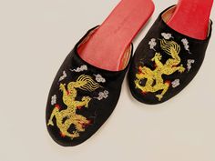 Golden dragon is always a symbolic design that represents the imperiality of the emperor. We used gold metallic thread in different shades of embroidery to show the delicate appearance. Almond toe with padded soles for adding comfort. They are handcrafted using butter-soft leather lining and insole. Outsole is leather in soft brushed handfeel. Narrow fit with low heel for extra elegance. You can pair with your favorite jeans for a stroll on Sunday farmer's market, or make yourself comfy with our Dragon Slippers, Slippers Wedding, Embroidered Dragon, Luxury Slippers, Velvet Mules, Wedding Slippers, Velvet Slippers, Golden Dragon, Satin Shoes