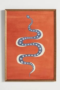 an orange painting with a snake painted on it's side in blue and white stripes