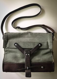 Visit us at https://www.caribecasualinteriors.com/ A 1965 Swiss Army ammo bag with a leather shoulder strap, made from heavy-duty canvas and beautiful saddle leather. Ipad size. Visit us at www.caribecasualinteriors.com Vintage Shoulder Bag With Adjustable Strap For Adventure, Vintage Brown Shoulder Bag For Adventure, Vintage Crossbody Shoulder Bag For Everyday Carry, Vintage Waxed Canvas Crossbody Shoulder Bag, Canvas Satchel Shoulder Bag For Adventure, Vintage Canvas-lined Crossbody Shoulder Bag, Vintage Satchel For Everyday Carry, Adventure Canvas Satchel Shoulder Bag, Vintage Crossbody Satchel For Everyday