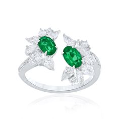 Elegant and exquisitely detailed 18 Karat White Gold Ring, center set with 0.79Cts .Oval Shape Emerald and micro pave set Diamonds, weighing approx. 1.23Cts Beautifully Hand crafted in 18 Karat White Gold. Stone Detail: Emerald: 6x4MM Stone Weight: Emerald: 0.79 Diamond: GH/SI Total Diamond Weight: 1.23Cts NOTE: Currently Only available in US Size 7. Customized Ring Size Available on Request Ring Jewellery Design, Emerald Diamond Ring, Birthday Jewelry Gift, Gold Stone, White Gold Ring, Jewelry Ring, Micro Pave, Wedding Wear, Cocktail Ring