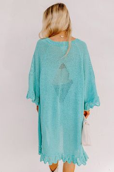 Relax in the summer evening breeze with this cute turquoise cardigan featuring lightweight knit material, oversized half sleeves, ruffle trim detailing, and a draped open front silhouette that falls into a straight mid-calf length hemline! Measurements S : Bust 46", Hip 44", Length 38", Sleeve Length 19", Waist 44". M : Bust 48", Hip 46", Length 39", Sleeve Length 19", Waist 46". L : Bust 50", Hip 46", Length 39", Sleeve Length 19.5", Waist 46". Chic Green Summer Cardigan, Flowy V-neck Cardigan For The Beach, Oversized Knit Cardigan For Beach, Oversized Summer Knit Cardigan, Summer V-neck Solid Color Cardigan, Oversized Knit Cardigan For The Beach, Casual V-neck Cardigan For Beach Cover-up, Oversized Short Sleeve Cardigan For Spring, Summer Green Knit Cardigan