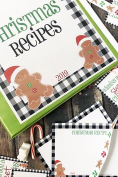 christmas recipe book with gingerbread cookies and candy canes on the table next to it