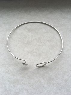 handmade Silver open circle bracelet. Dainty, minimalist, and stackable. Modern Circle Bracelets For Everyday Wear, Modern Everyday Circular Bracelets, Minimalist Hoop Sterling Silver Bracelets, Minimalist Sterling Silver Hoop Bracelets, Modern Adjustable Hoop Bracelets, Modern Adjustable Hoop Cuff Bracelet, Minimalist Adjustable Sterling Silver Oyster Bracelet, Adjustable Minimalist Cuff Bracelet, Adjustable Minimalist Round Cuff Bracelet