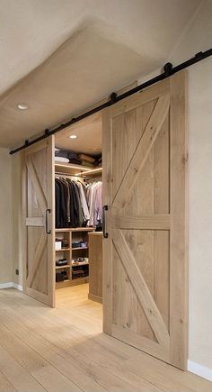 an open barn door in the middle of a room