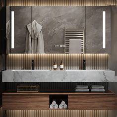 a modern bathroom with marble counter tops and wooden cabinets, along with towels on the shelf