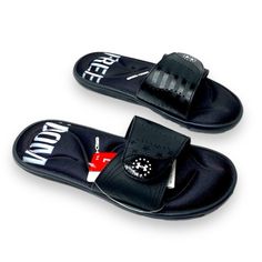 Under Armour Freedom Ignite Black And White Slip On Sandals 4d Foam Cushioned Footbed Adjustable Front Straps New With Tags Black Round Toe Sport Sandals For Vacation, Black Synthetic Slippers For Summer, Comfortable Black Slip-on Sport Sandals, Black Non-slip Sport Sandals For Summer, Black Closed Toe Sport Sandals For Beach, Non-slip Open Toe Flip Flops For Streetwear, Black Non-slip Sandals For Vacation, Black Synthetic Slip-on Slippers, Black Slip-on Slippers For Vacation