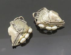 "925 Silver - Vintage Baroque Pearls Modernist Non Pierce Earrings - EG10390  925 Silver - Vintage Baroque Pearls Modernist Non Pierce Earrings - EG10390  Jewelry Type:         Earrings   Metal Type:            925 Silver   Metal Size:             1.5\"  Stone Type:            Pearls   Condition:              N/A  Jewelry Weight:     24.7 Grams  PLEASE NOTE: THIS ITEM IS PRE-OWNED. ALTHOUGH MOST ITEMS ARE IN VERY GOOD CONDITION, SOME MAY NEED CLEANING AND/OR MINOR REPAIRS. WE MAKE A VERY STRONG EFFORT TO UPLOAD CLEAR PICTURES. PLEASE INSPECT ALL PICTURES AND ASK ALL QUESTIONS YOU MAY HAVE PRIOR TO MAKING A PURCHASE. NOT ALL STONES ARE GENUINE, SOME ARE ENHANCED OR CREATED." Antique Silver Pearl Earrings For Anniversary, Silver Victorian Pearl Earrings For Anniversary, Ornate Silver Pearl Earrings, Victorian Silver Pearl Earrings For Anniversary, Silver Baroque Pearl Earrings For Formal Occasions, Silver Baroque Pearl Earrings For Formal Events, Baroque Pearl Earrings In Silver For Formal Occasions, Baroque Pearl Earrings In Silver For Formal Events, Formal Baroque Pearl Earrings In Silver