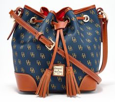 Dooney & Bourke's signature monogram makes this drawstring crossbody instantly recognizable. Interior zip and slip pockets make it fully functional -- a bag-lover's dream come true. From Dooney & Bourke. Dooney And Bourke Disney, Small Drawstring Bag, Dooney & Bourke Bag, Brown Crossbody Bag, Dooney Bourke Handbags, Dooney & Bourke Bags, Dooney & Bourke, Dooney Bourke, Crossbody Shoulder Bag