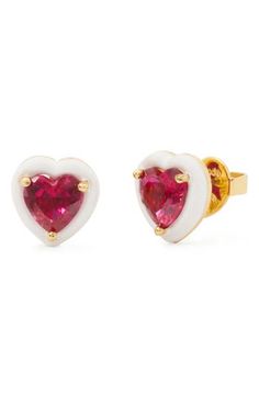 Colorful crystals framed by white enamel bring playful sparkle to these dainty stud earrings that make for a heartfelt gift. 3/8"W x 3/8"L Post back Goldtone plate/enamel/cubic zirconia Imported White Heart-cut Earrings For Valentine's Day, White Heart Cut Earrings For Valentine's Day, Valentine's Day Heart Charm Enamel Earrings, White Heart Charm Earrings For Valentine's Day, White Heart Earrings For Mother's Day, Heart Cut Enamel Jewelry For Gifts, Valentine's Day White Heart Charm Earrings, Valentine's Day Gift Enamel Earrings, White Double Heart Earrings For Gift