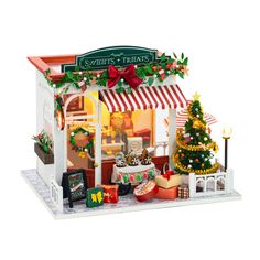 a small toy store with christmas decorations on display