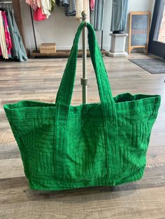 This extra large green tote bag is a spacious and stylish accessory that exudes fun and relaxation. The vibrant green color will add a pop of color to any outfit. Withe textured cloth, this piece will guarantee visual interest to any look. This tote is designed to be practical and functional, with ample room for all your essentials. Trendy Green Large Capacity Bag, Trendy Large Capacity Green Bag, Trendy Green Shoulder Bag With Large Capacity, Casual Green Rectangular Bag, Trendy Green Canvas Bag, Trendy Green Tote Shoulder Bag, Trendy Green Tote Bag, Casual Textured Tote Shoulder Bag, Trendy Green Large Capacity Canvas Bag