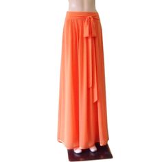 "It is made from soft and good quality Chiffon fabric. This is made to order in your measurements. Skirt length: 38\" .It can be made longer or shorter. It is made with a zipper. You can choose other color from the color chart. When you order please give me your measurements: 1: The length of skirt from the top of the waistline to bottom hem . 2: Waist ( where you want the waistline to be) . 3: Hips ( around the fullest part) 4: And your color choice. Tailoring time: 1-2 weeks before shipping. C Fitted Chiffon Beach Bottoms, Fitted Chiffon Bottoms For Beach, Elegant Orange Flowy Skirt, Flowy Orange Maxi Skirt With Elastic Waistband, Elegant Chiffon Maxi Skirt For Beach, Fitted Chiffon Maxi Skirt, Elegant Long Orange Skirt, Flowy Chiffon Skirt With Elastic Waistband, Elegant Orange Long Skirt