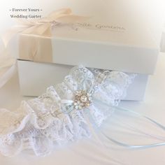 "Pretty white lace, with a central white and gold threaded ribbon. The lace is gently gathered onto a band, fine bows and a cluster of dainty flowers, complete this lovely garter. One size 14\"-22\" Sent in pretty tissue. Sorry, this item is not gift boxed. Usually in stock and dispatched within a few days, remember to add postage time. If you need your set urgently, please message me, I always try to help!" Elegant White Lace For Ceremony, Adjustable Bridal Accessories For Ceremony, Adjustable Lace Bridal Accessories For Ceremony, White Adjustable Bridal Accessories For Formal Occasions, White Bridal Accessories For Ceremony, Elegant Bridal Accessories With Lace Trim For Wedding, Elegant Wedding Bridal Accessories With Lace Trim, Elegant Lace Bridal Accessories For Ceremony, Fitted Cream Bridal Accessories For Ceremony