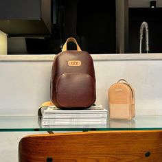 Custom Leather Backpack handmade-to-order, personalized to your specs. 5oz vegetable-tanned leather dyed light brown Dual-layer straps with contrasting natural top-layer & stud-post adjustment Dimensions: 8" x 11.5" x 4" Backpack includes 3 pockets: Main pocket with zipper closure Front pocket with zipper closure Rear pocket sleeve (easily holds larger cell phones and smaller sized wallets *Optional monogram or initials* Brown Chest Bag For Daily Use, Brown Smooth Grain Standard Backpack, Brown Leather Backpack With Smooth Grain, Brown Satchel Chest Bag For School, Brown Leather Satchel Chest Bag, Brown Leather Satchel Backpack With Smooth Grain, Brown Leather Chest Bag For Everyday Carry, Brown Soft Leather Chest Bag For Everyday Use, Brown Leather Backpack For Everyday