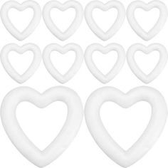 white heart shapes are arranged in the shape of hearts on a white background, set of twelve