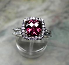 AAAA 7x7mm 1.76 ct Natural Rhodolite garnet by mastergoldcraft, $1025.00--love love love love love love! The setting is perfect, sigh... Diamond Cut Gemstones For Wedding, Platinum Gemstones With Halo Setting For Wedding, Wedding Platinum Gemstones With Halo Setting, Royal Purple Color, Flush Set Diamond, Glitter Glasses, Dream Engagement, Gold Halo, Rhodolite Garnet