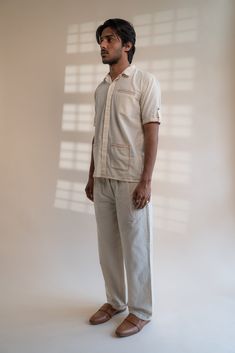 This Dawning Patch Pocket Shirt comes in a calm and soothing color. This 60s cotton shirt is undyed and unbleached. Replete with a spread collar, this half-sleeve shirt has an inverted pleat at the back and patch pockets in the front. The pockets and sleeve hems are embellished with Kantha, a form of Indian hand embroidery. *This item is a final sale and not eligible for returns or exchanges. *This item can take up to 14 business days to ship as it is made to order for you. White Short Sleeve Shirt With Patch Pockets, Beige Cotton Buttoned Camp Shirt, Cream Cotton Shirt With Relaxed Fit, Classic Beige Cotton Short Sleeve Shirt, Beige Cotton Camp Shirt With Relaxed Fit, Beige Relaxed Fit Camp Shirt With Pockets, Neutral Cotton Shirt With Relaxed Fit, Beige Cotton Short Sleeve Shirt With Pockets, Classic Neutral Cotton Shirt