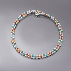 PRODUCT DETAIL : ITEM: MULTI GEMSTONE BEADED NECKLACE ITEM CODE: DGC4226 ITEM NAME: NECKLACE GEMSTONE: PEARL, GREEN ONYX, BLUE CHALCEDONY, CARNELIAN, YELLOW HELIODOR BEADS SHAPE: SMOOTH AND FACETED RONDELLE LENGTH: 18 INCH APPROX BEADS SIZE: 2.5 MM Approx. WEIGHT : 23 Cts. APPROX CUSTOMIZATION/BULK ORDER : AVAILABLE PLEASE FEEL FREE TO CONTACT IF YOU REQUIRE ANY FURTHER INFORMATION. Multicolor Spacer Beads Jewelry, Multicolor Single Strand Round Jewelry, Multicolor Single Strand Crystal Necklace With Round Beads, Multicolor Single Strand Crystal Necklace For Gift, Multicolor Single Strand Crystal Necklace Gift, Multicolor Polished Beads Choker Jewelry, Multicolor Multi-strand Gemstone Beaded Necklace, Multicolor Polished Beads Choker, Elegant Multicolor Multi-stone Beaded Necklace