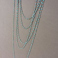 ***Minimum order is $10.00 - Prior to shipping charges. ***Minimum Shop Order: $10.00 Merchandise, prior to shipping charges.TINY glass seed beads, notice the quirky shape of the beads used to make this glass chain, so much better than a plain round bead.  The silver plated metal is clean and in very good shape - this rosary chain, although delicate will not fall apart!1 Order = 5 FeetSee last photo with all 3 colors, Sky Blue, Peridot, Turquoise, beautiful!!Gold plated version:https://www.etsy. Unique Turquoise Jewelry With Tiny Beads, Turquoise Multi-strand Jewelry With Tiny Beads, Turquoise Multi-strand Tiny Beads, Turquoise Multi-strand Beaded Necklaces With Tiny Beads, Turquoise Multi-strand Beaded Necklaces, Turquoise Multi-strand Tiny Beads Necklace, Blue Turquoise Necklace With Spacer Beads As Gift, Blue Beaded Chain Turquoise Necklace As Gift, Blue Turquoise Necklace With Beaded Chain As Gift