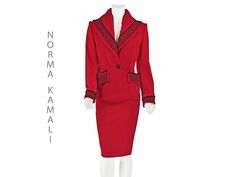 It's been quite a while since I've seem a great vintage garment from Norma Kamali, but it was worth the wait! This exquisite 1980s red suit is 100% wool bedecked with black soutache and braid trimming the collar, lapels, pocket flaps, and cuffs. It's hard to see in the photos, but the fabric is woven with a window pane pattern and twill stripes. The shawl collar is padded and gathered at the back of the neck, creating a flattering, face-framing shape. The jacket also has substantial shoulder pad Vintage Suit, Vintage Suits, Red Suit, Worth The Wait, Window Pane, Norma Kamali, Wool Suit, Red Wool, Face Framing