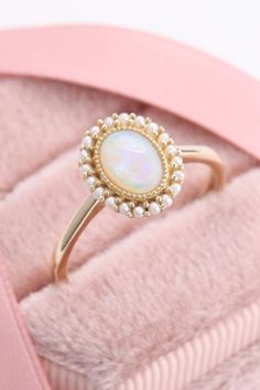 This vintage opal ring is absolutely gorgeous #opalring #vintagering #goldring Opal Wedding Ring Vintage, Opal Pearl Ring, Opal Flower Ring, Opal Ring With Diamonds, Vintage Opal Engagement Rings, Pearl And Opal Engagement Ring, Pearl And Opal Ring, Gold Multi-stone Oval Cabochon Ring, Formal Opal Rings With Gemstone Accents