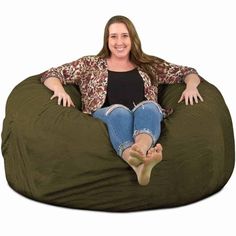 a woman sitting on a bean bag chair