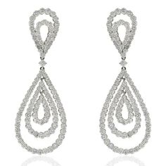 Indulge in the captivating allure of these exquisite 18K White Gold 21 Carat Diamond Chandelier Dangling Earrings. Crafted with meticulous attention to detail, these estate diamond drop earrings showcase the timeless elegance of fine jewelry.Adorned with a magnificent array of round cut diamonds, totaling approximately 21.00 carats, these earrings exude a mesmerizing brilliance that will leave you spellbound. Each diamond exhibits the utmost quality, boasting a pristine G color and VS clarity, e Diamond Chandelier Earrings 1stdibs, Luxury Pear-shaped Chandelier Earrings For Formal Events, Elegant Cartier Diamond Earrings, Luxury Cartier Diamond Earrings, Platinum Pear-shaped Diamond Earrings For Formal Occasions, Formal Diamond Cut Chandelier Earrings, Formal Platinum Diamond Earrings With Elegant Design, Platinum Bridal Earrings With Diamond Accents For Evening, Exquisite Diamond Cluster Earrings For Formal Occasions