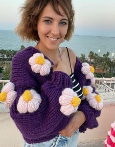 I am happy to present you a special design from my Etsy store. This cardigan, which I have knitted with its own region and woven with carefully selected thick purple yarns, is waiting to add an elegant touch to your style. However, it is not only a knit cardigan, but also draws attention with the daisies knitted and embroidered with the 3D technique. Features: Material: Durable and warm design, knitted with high quality purple thick yarn. Technique: Daisies knitted with the 3D knitting technique used on the front of the cardigan add depth and touch to the product. Size: Designed to fit standard sizes. Thanks to its comfortable cut, it is ideal for daily use. Handmade: Each blended and lovingly knitted cardigan is a unique handmade item. This hand-knit cardigan will both keep you warm on co Trendy Purple Knitted Cardigan, Purple Knitted Cardigan, Knitted Flower Cardigan, Purple Flower Cardigan, Chunky Flower Cardigan, Thick Cardigan, Purple Cardigan, Embroidered Cardigan, Thick Yarn