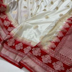 Exclusive designer arri handwork pure katan silk Banarasi saree with blouse piece  in India made by our beloved workers please support us  Important : please  share your contact number whenever you make payment it's mandatory for standard shipping Occasions: Wedding|Party|Festivals|Puja White And Red Banarasi Saree, White Meenakari Traditional Wear For Puja, Elegant Red Saree With Meenakari Detailing, Red Tussar Silk Dupatta With Meenakari, Ceremonial Red Saree With Meenakari, Red Meenakari Saree For Ceremonial Occasions, Ceremonial Red Meenakari Saree, Ceremonial White Banarasi Silk Dupatta, Ceremonial Katan Silk Saree With Meenakari