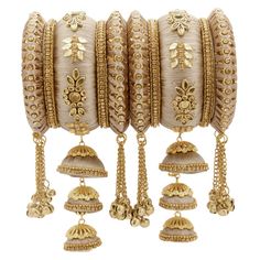 PRICES MAY VARY. Occasion: Take your style up a notch with this handcrafted piece of jewellery; Enamelled and embellished with rhinestone, crystal, faux pearl, it is perfect for a traditional yet contemporary look Outfits: Ideal for any ethnic outfits like sarees, lehengas, gowns, bridal wear or for parties, festivals, dance or any special occasion or as fashion costume accessories Perfect Gift for your Loved Ones: Love for jewels never fades away. Jewelry is one of the most spectacular & popula Ghungroo Bangles, Pakistani Bangles, Kundan Work, Kundan Bangles, Bracelet Fil, Silk Thread Jewelry, Silk Thread Bangles, Thread Bangles, Bracelets Design