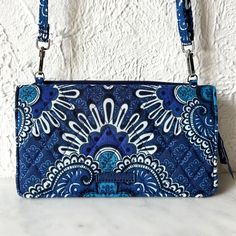 Vera Bradley Rfid Wallet Crossbody Bag In Blue Tapestry Pattern Is New Without Tags. Crossbody Wallet Has Magnetic Closure Main Compartment With Id Window, Two Slip Pockets And Thirteen Card Slip Pockets. Rfid Protection For Credit And Debit Cards. Exterior Zippered Pocket. 8" X 4-1/2" X 1-1/2". Removable, Adjustable Strap With Longest Drop 27". Tapestry Pattern, Blue Tapestry, Rfid Wallet, Crossbody Wallet, Debit Cards, Women Accessories Bags, Blue Bags, Magnetic Closure, Vera Bradley