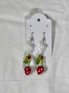 Strawberry Fruit Beaded Dangle Earrings Jewelry Multicolored Trendy Dainty Cottage Core Coquette Earrings Beautiful Glass Bead Earrings These strawberry fruit beaded dangle earrings are made with pearls, glass beads crystal beads, and nickel-free hardware and coated in tarnish-resistant sealant. These pair beautifully with the strawberry choker necklace, available here: Please don't hesitate to reach out if you have any questions! Strawberry Choker, Coquette Earrings, Cottage Core Jewelry, Glass Bead Earrings, Strawberry Fruit, Funky Jewelry, Beaded Dangle Earrings, Jewelry Inspo, Bead Earrings