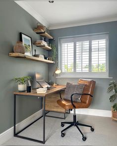 a home office with a desk, chair and bookshelf in the corner by the window