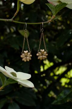 These are wonderfully detailed dogwood flower earrings for all you fellow dogwood tree lovers, flower lovers, and botanical besties out there. They are a great medium size dangle earring and are super lightweight, yet durable, made of solid (not plated) raw brass with solid sterling silver ear hooks. There are two finishes you can choose from either with a patina to enhance the antique feel and highlight the texture, or shiny. Please select your preference from the drop down menu length: 2 1/2 i Vintage Gold Flower Shaped Earrings, Vintage Gold Flower-shaped Earrings, Vintage Flower Charm Dangle Earrings, Vintage Flower Shaped Earrings, Vintage Flower-shaped Pierced Earrings, Vintage Gold Earrings With Flower Charm, Vintage Flower-shaped Earrings For Anniversary, Vintage Drop Earrings With Flower Charm, Brass Flower-shaped Earrings For Gifts